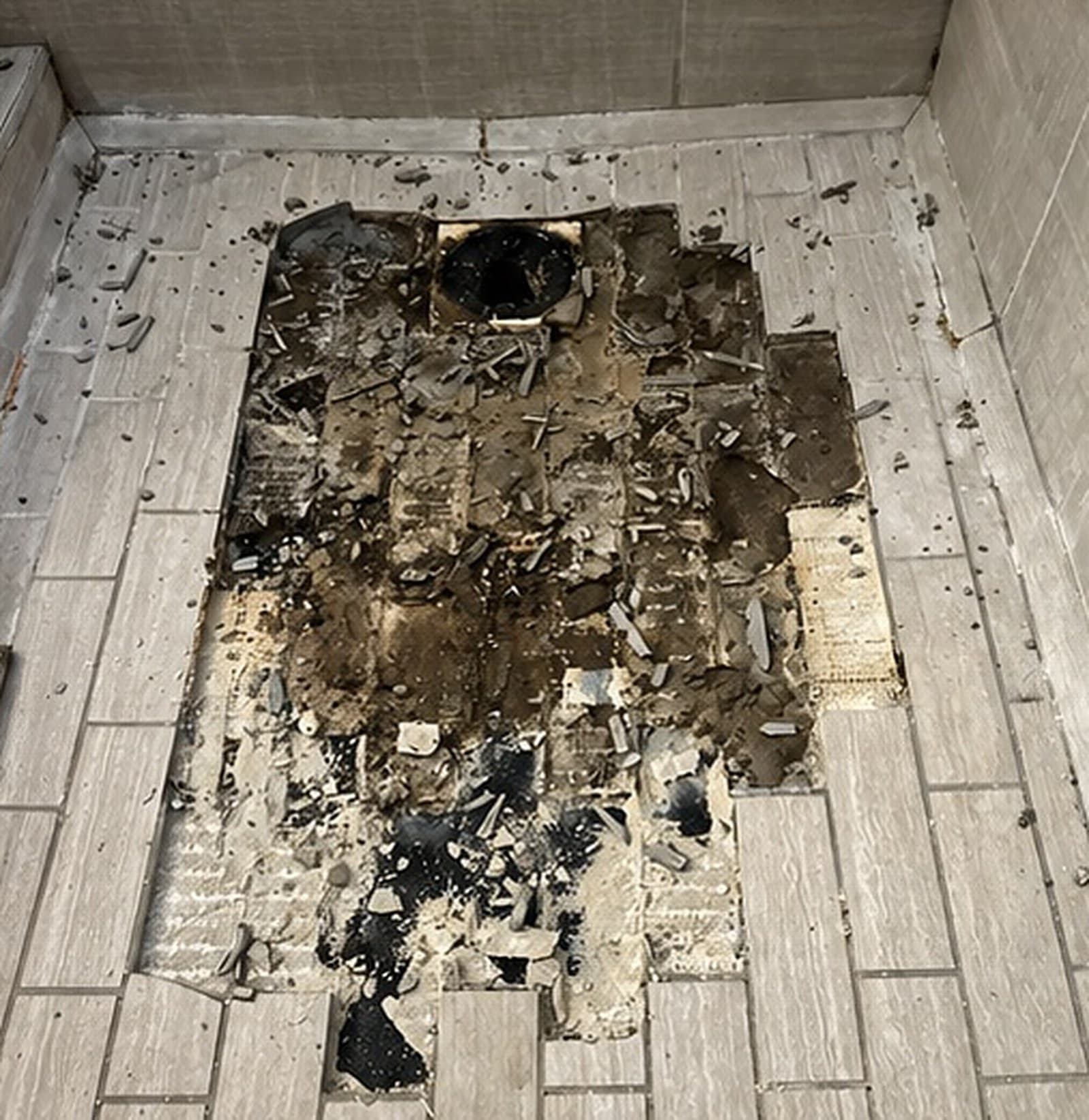Shower floor with the old floor removed down to the base